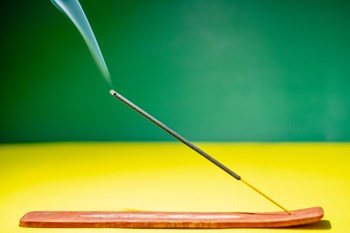 Incense stick burning in holder