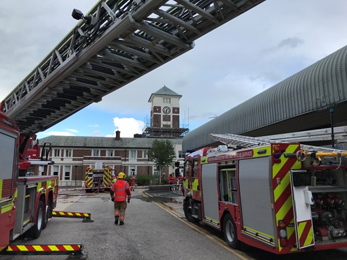 An image of fire engines in front of the Trafford General clock tower
