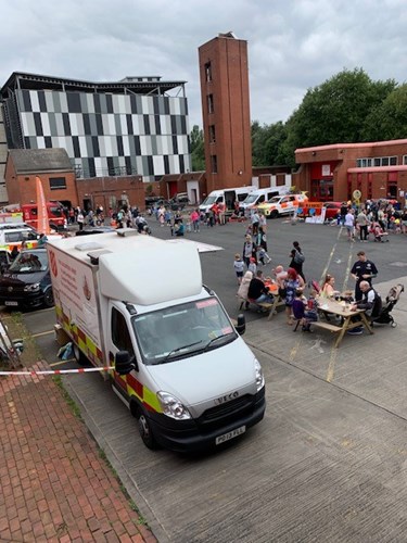 Image shows visitors at Bolton Central open day along with vehicles and activities