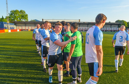 GREATER Manchester Fire and Rescue Service (GMFRS) firefighters and Grenfell Athletic team meeting one another on the pitch