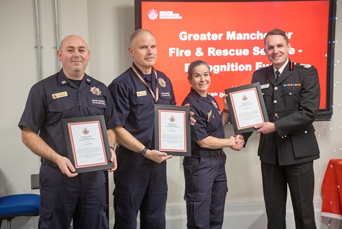 (From left to right) FF Chris McCool, FF Neil Massey and FF Carole Jaszewski receiving their awards from CFO Dave Russel