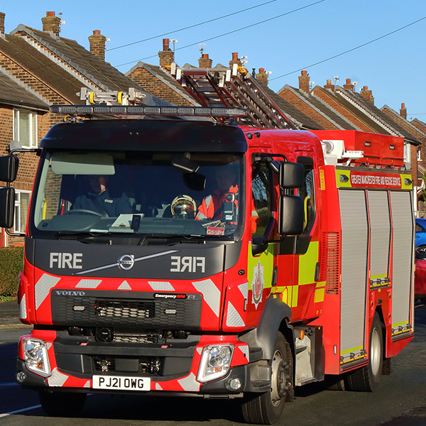 Fire engine with bright blue sky behind
