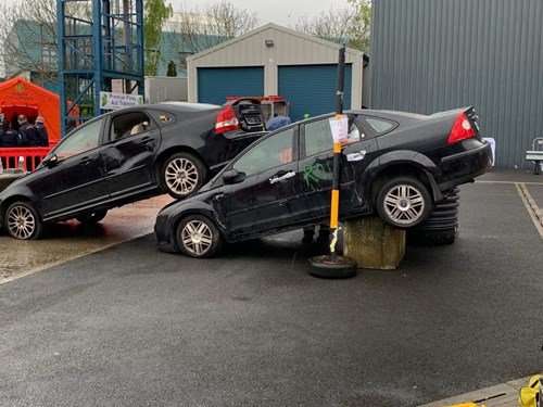 An image of two cars simulating a collision