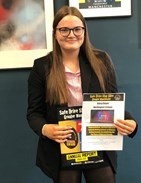 Competition Winner Daisy Boyer from Wellington Sixth Form smiling and holding up Safe Drive certificate