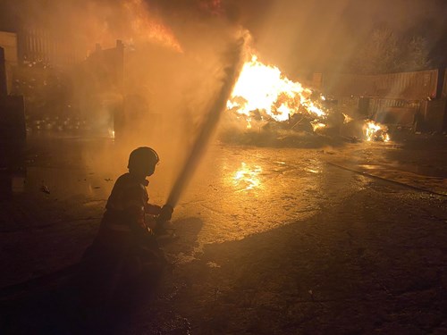 Firefighter tackles fire at scrap yard in Bury