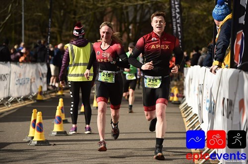 2 members of the triathlon team competing in a race